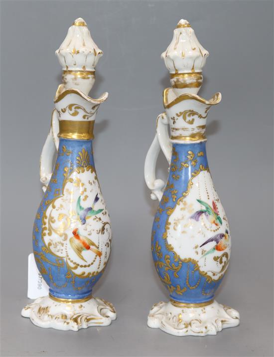 A pair of Paris pear shaped ewers and stoppers, height 25cm